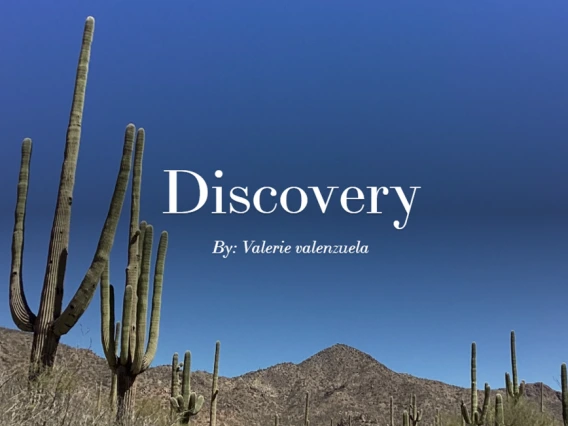 A clear blue sky over desert mountains and tall saguaro cacti, with the word "Discovery" and the name "By: Valerie Valenzuela" written in white serif font.