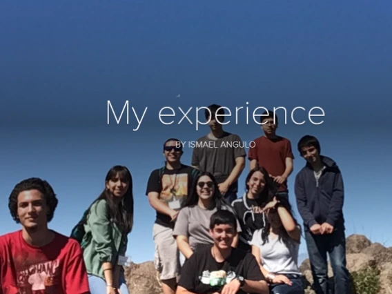 A group of students smiling under a clear blue sky, with the overlay text "My experience" by Ismael Angulo.